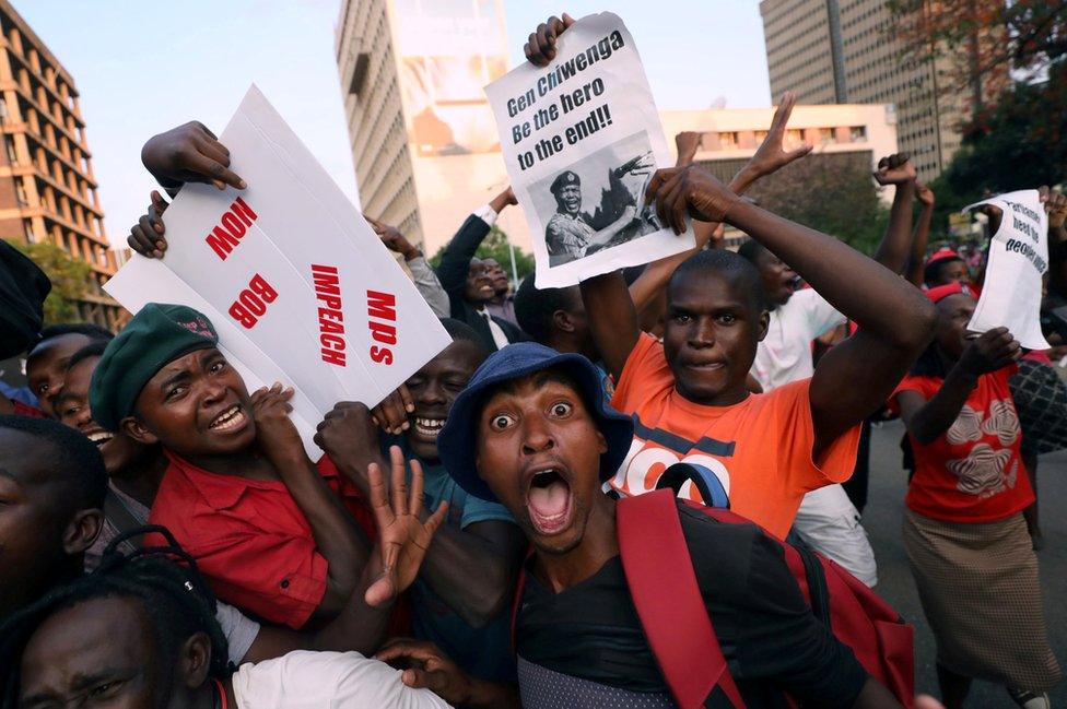 Zimbabweans celebrate after President Robert Mugabe resigns in Harare, Zimbabwe, 21 November 2017.