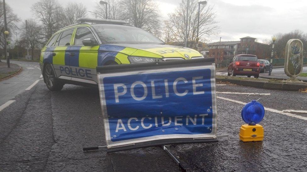 Police car and accident sign