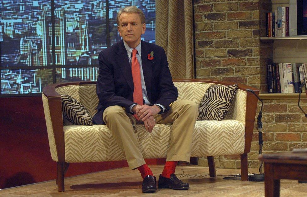 Former British ambassador to the US Sir Christopher Meyer seen on a sofa in a BBC studio wearing his signature red socks