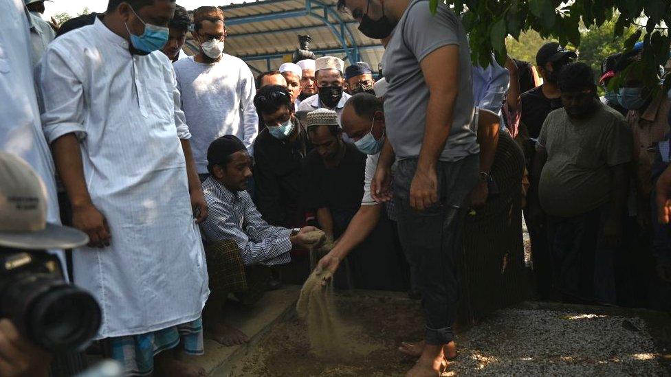 Mourners hold a funeral for National League for Democracy (NLD) party member Khin Maung Latt during his funeral in Muslim tradition