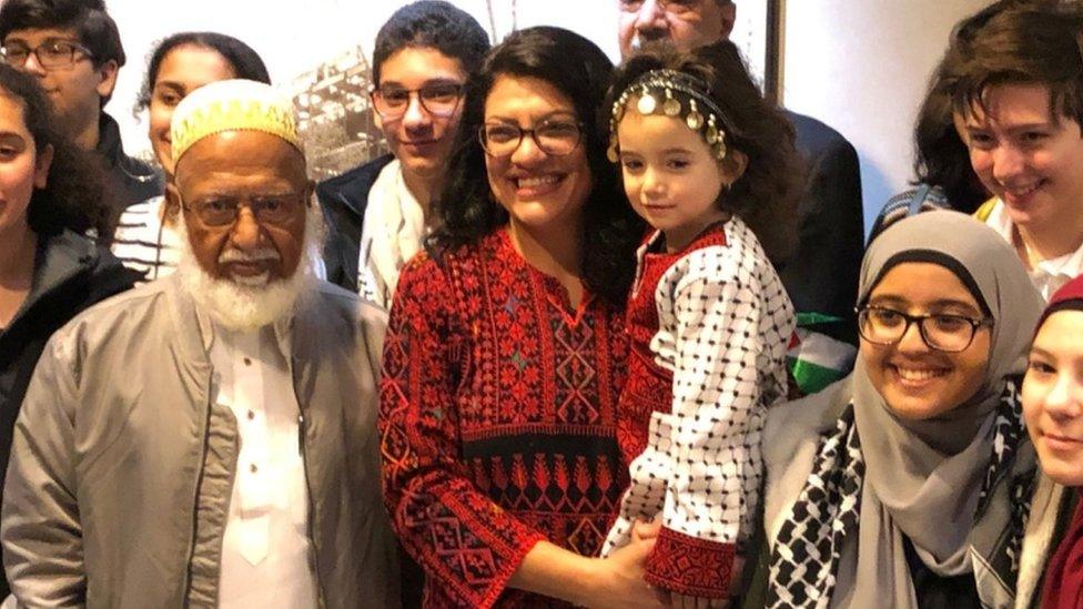 Ms Tlaib poses with supporters on her first day in Washington