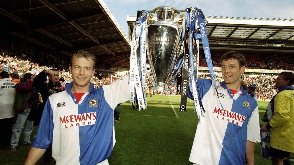 Alan Shearer and Chris Sutton of Blackburn Rovers celebrate with the Premiership trophy after winning the Premiership title during the FA Carling Premiership match against Liverpool played at Anfield in Liverpool, England.