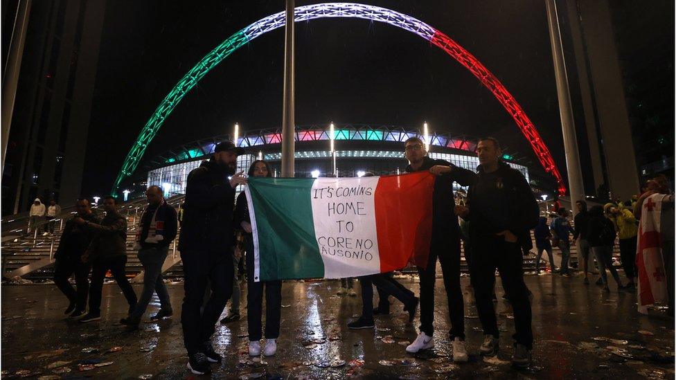 Italy fans celebrate after winning the Euro 2020 outside Wembley Stadium