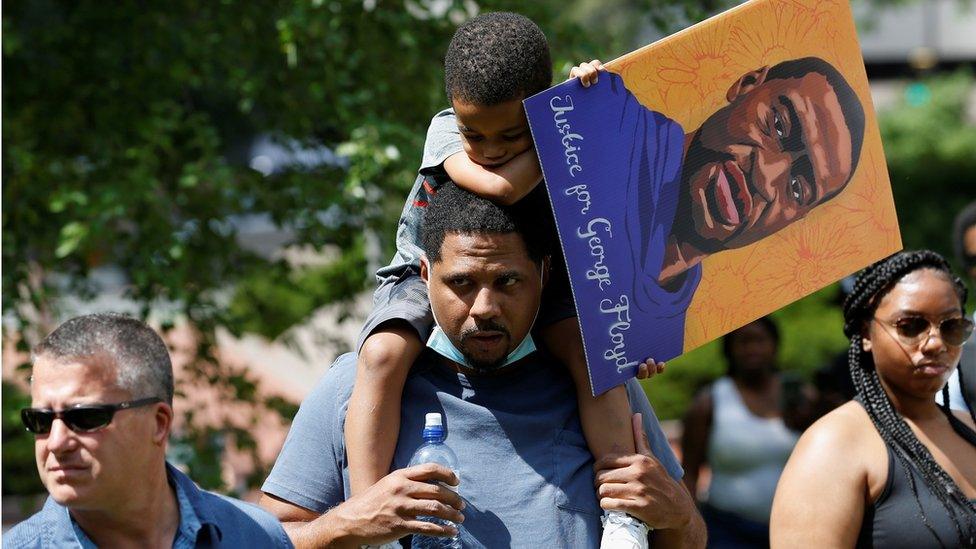 Supporters of George Floyd's family outside the courthouse in Minneapolis, MN (25 June)