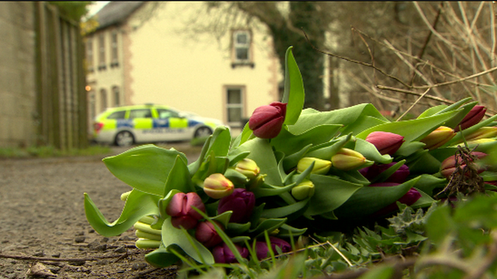 Floral tributes left at the scene