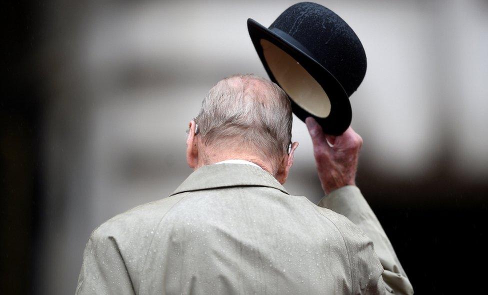 Britain's Prince Philip pictured from behind as he doffs his hat on 2 August, 2017.