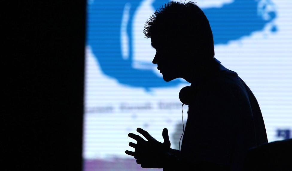 Saprikin Pavel of Uzbekistan prays in the e-Sports, FIFA 13 semi final at Samsan World Gymnasium in S Korea