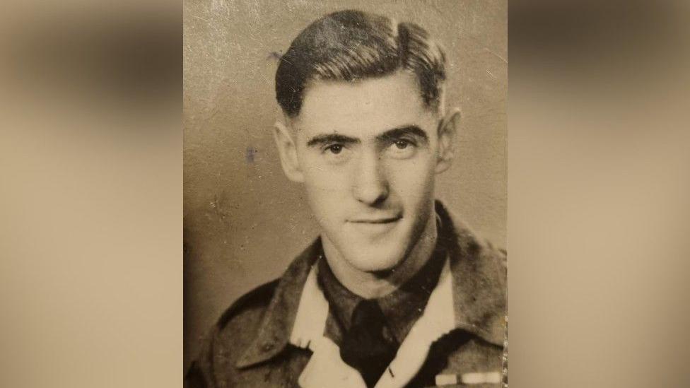 Mr Eskdale as a young man wearing his military uniform with swept back hair.