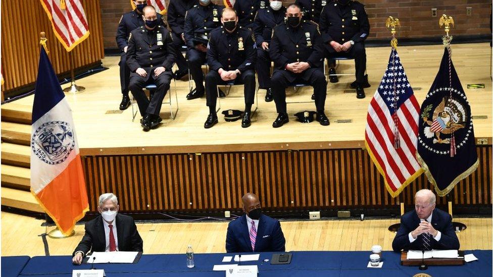 Mr Biden (far right) with the New York mayor and US attorney general