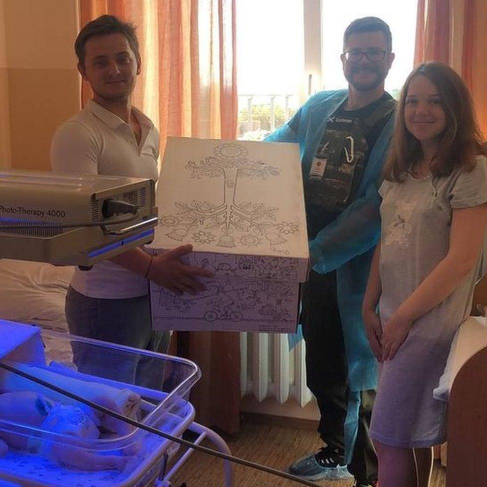 New parents in Ukraine with their new baby and baby box