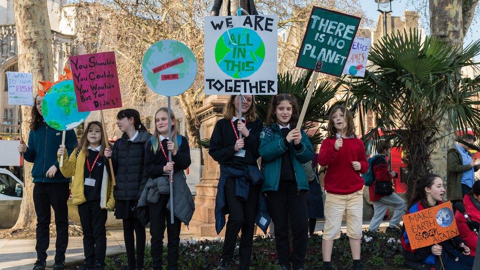 School-children-taking-part-in-a-climate-change-march.