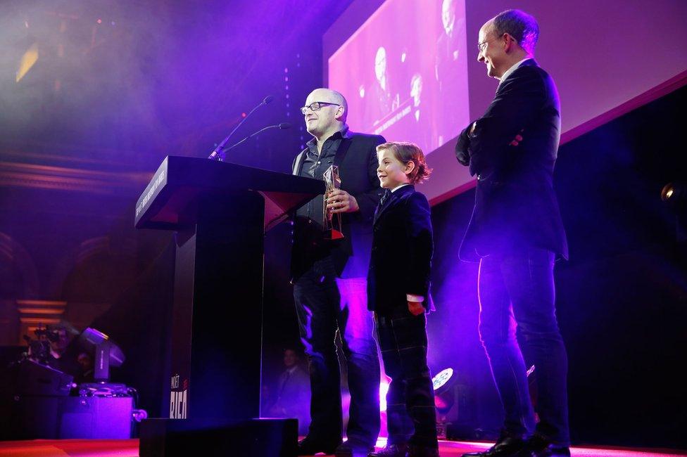 Director Lenny Abrahamson (left), young actor Jacob Tremblay (centre) and Producer Ed Guiney (right) accept the award for Room