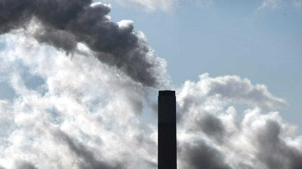 Smoke rising from a factory chimney