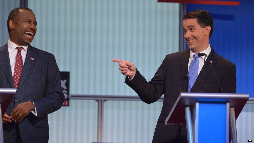 Ben Carson (left) and Scott Walker on stage during the Republican debate