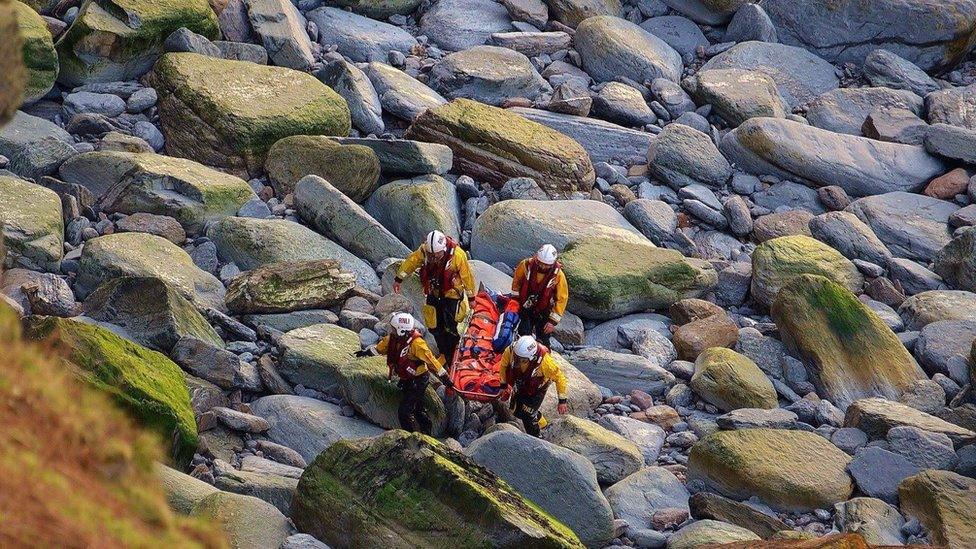 Emergency service workers with stretcher