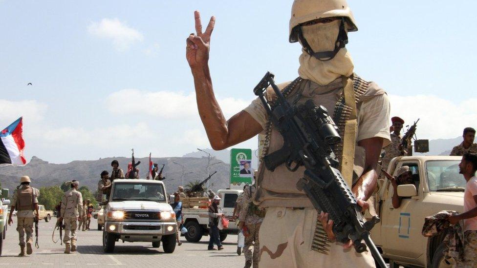 Yemeni fighter loyal to government stands guard during rally marking anniversary of south's revolt against British colonial rule in the southern city of Aden. October 13, 2016