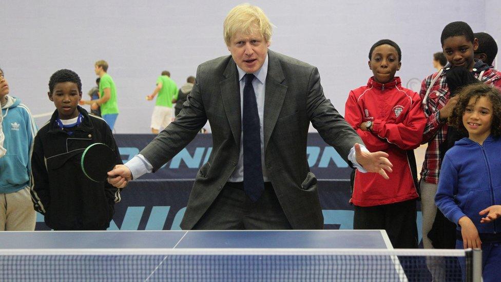 Boris Johnson playing ping-pong at a youth club