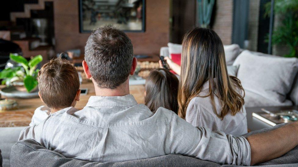 A family watching the TV