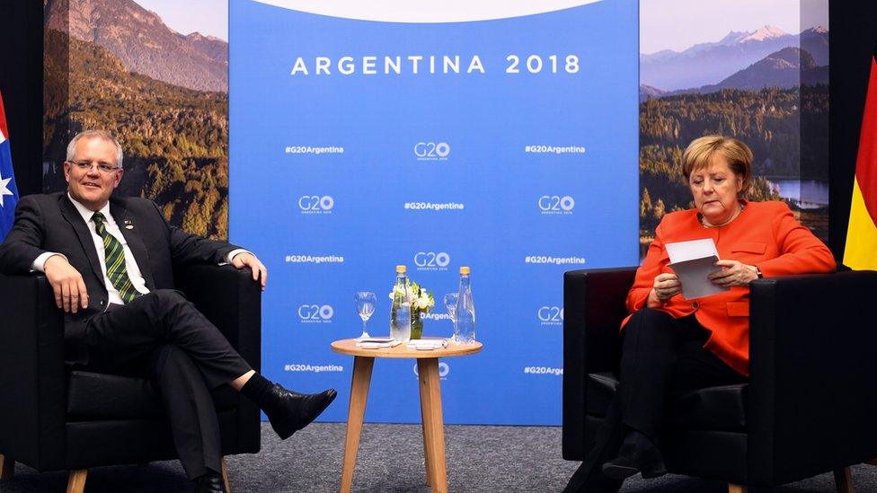 German Chancellor Angela Merkel sits down with Australian PM Scott Morrison at the G20 Summit