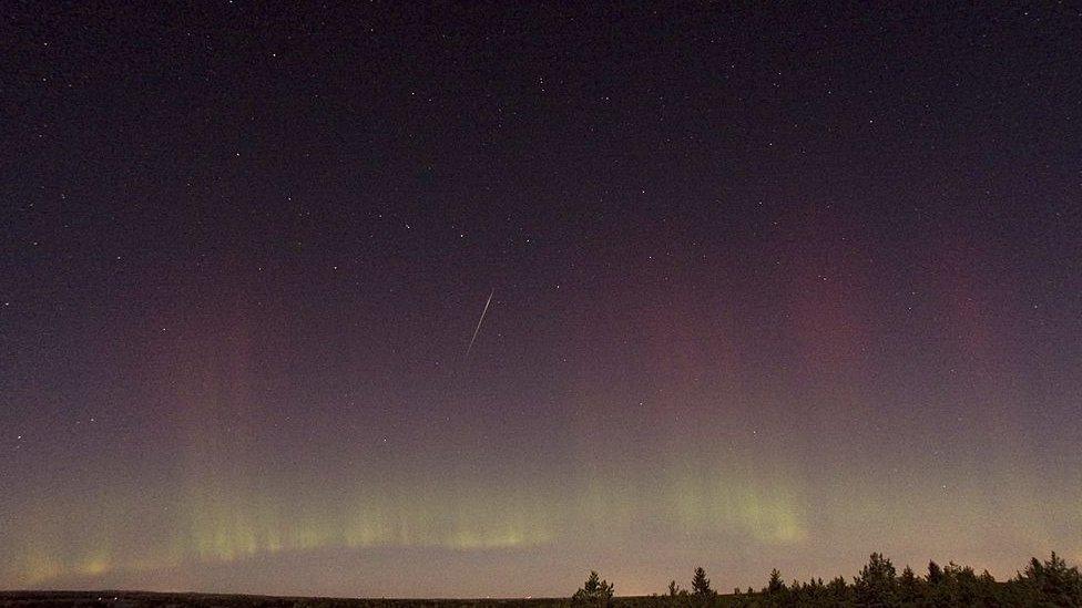 Shooting star (Draconid) and northern lights over Sweden in 2011