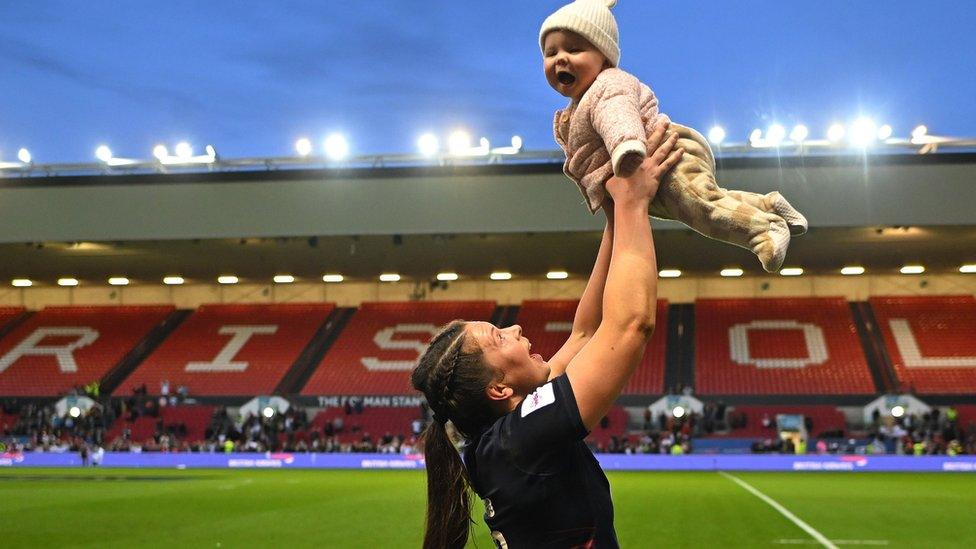 Abbie Ward in rugby kit after a game with her daughter Hallie