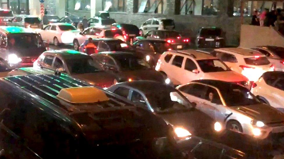 A queue or cars at a border checkpoint