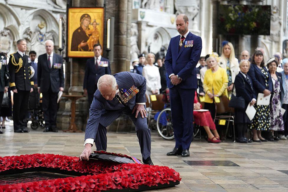 King Charles lays a wreath at the grave of the Unknown Warrior during a service of thanksgiving at Westminster Abbey in London on the 80th anniversary of VE Day.