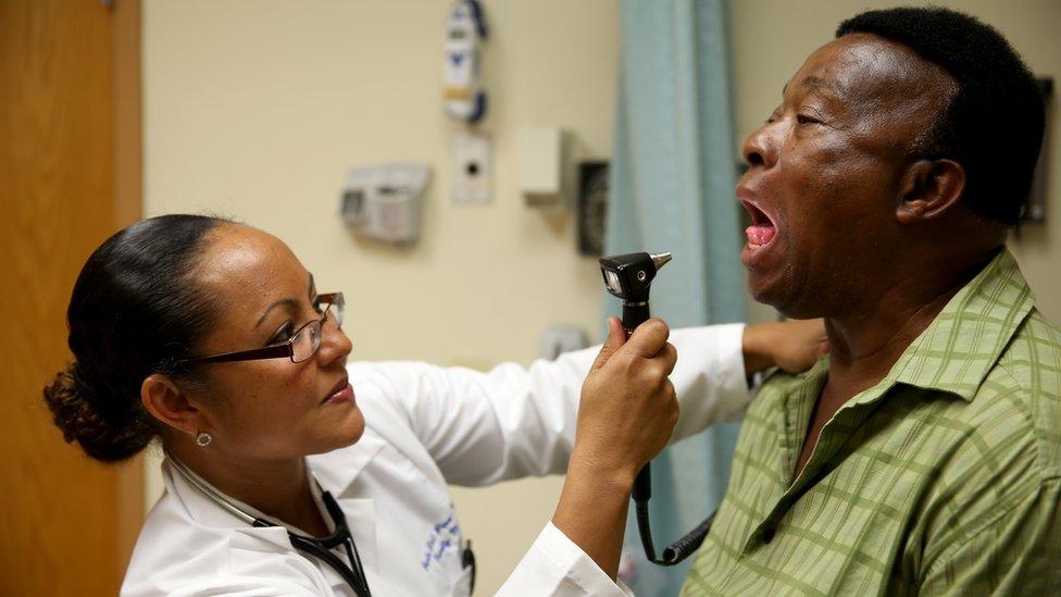 A doctor in Florida examines a patient newly insured under the Affordable Care Act