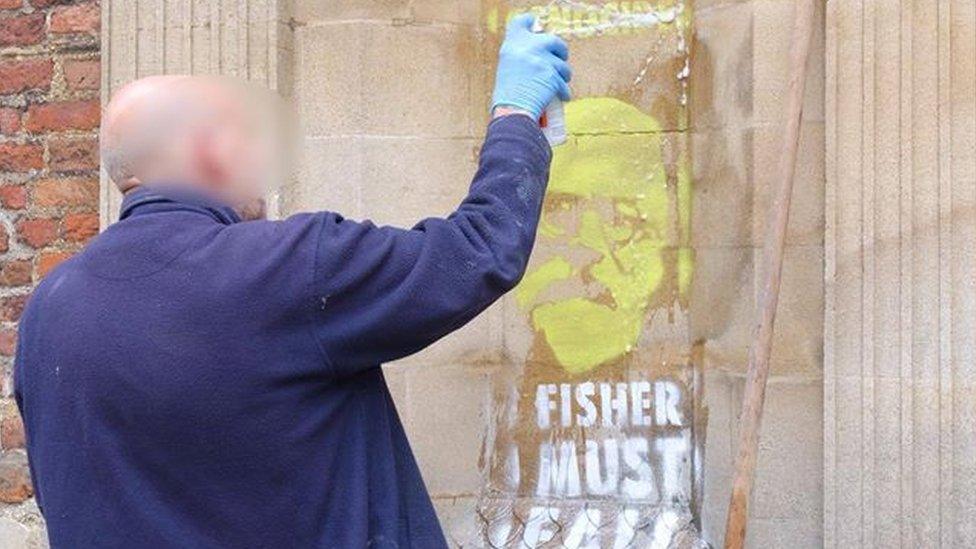 Work to clean the spray paint at the Gate of Honour