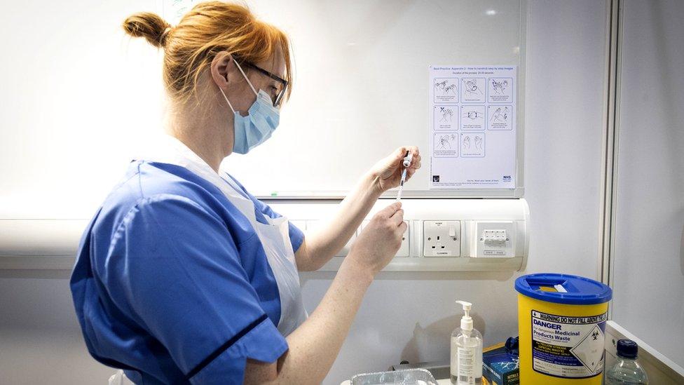 nurse preparing vaccination