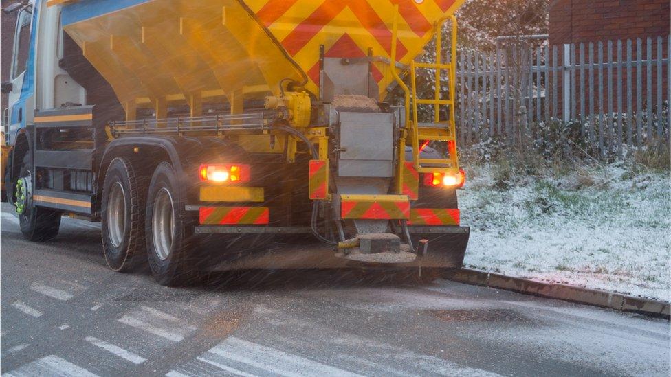 Stock Image gritter on icy road in snow