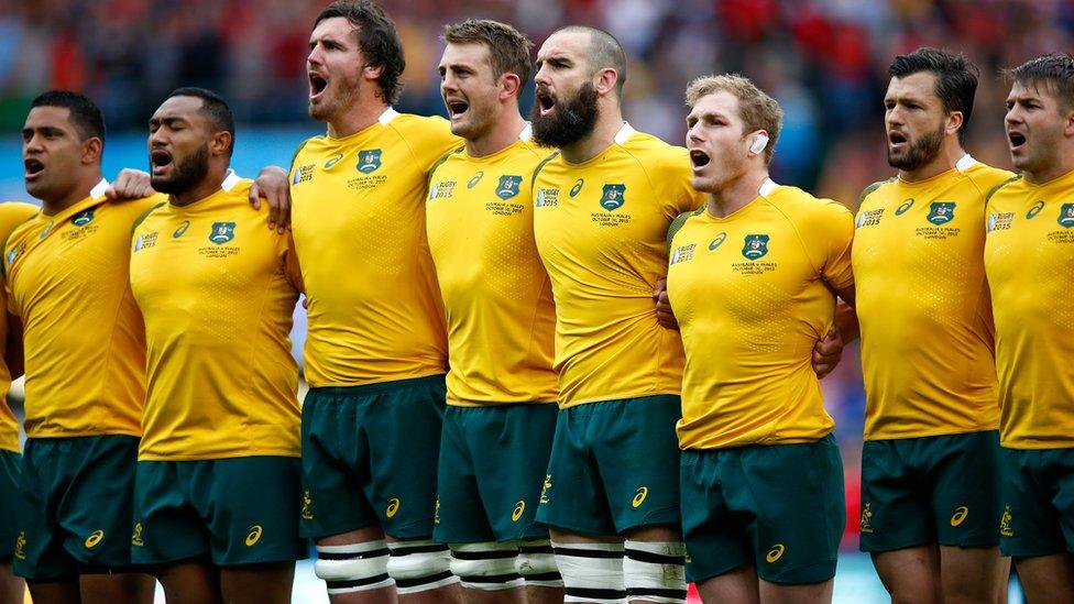 Australia players clasp shoulders and sing national anthem at Twickenham stadium