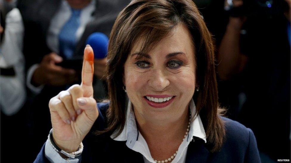 Guatemalan presidential candidate Sandra Torres, from the centre-left National Unity of Hope (UNE) party, shows her ink-marked finger after casting her vote, at a polling station during general elections in Guatemala City, on 6 September 2015.