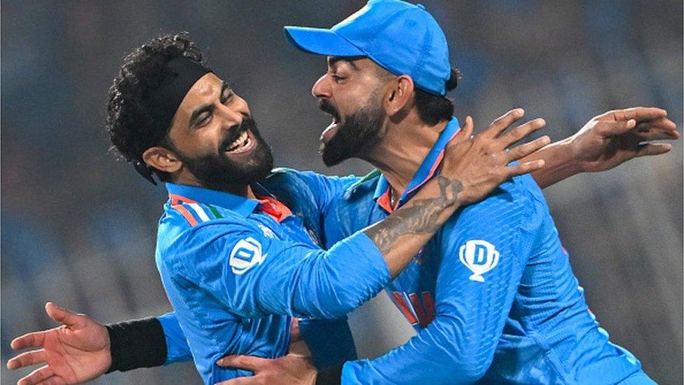 India's Ravindra Jadeja (L) celebrates with Virat Kohli after taking the wicket of South Africa's captain Temba Bavuma during the 2023 ICC Men's Cricket World Cup one-day international (ODI) match between India and South Africa at the Eden Gardens in Kolkata on November 5, 2023.