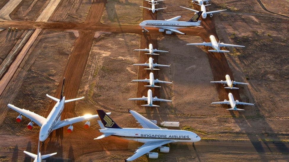 Airbus A380s, Boeing MAX 8s and other smaller aircrafts are seen at a storage facility in Alice Springs, Australia