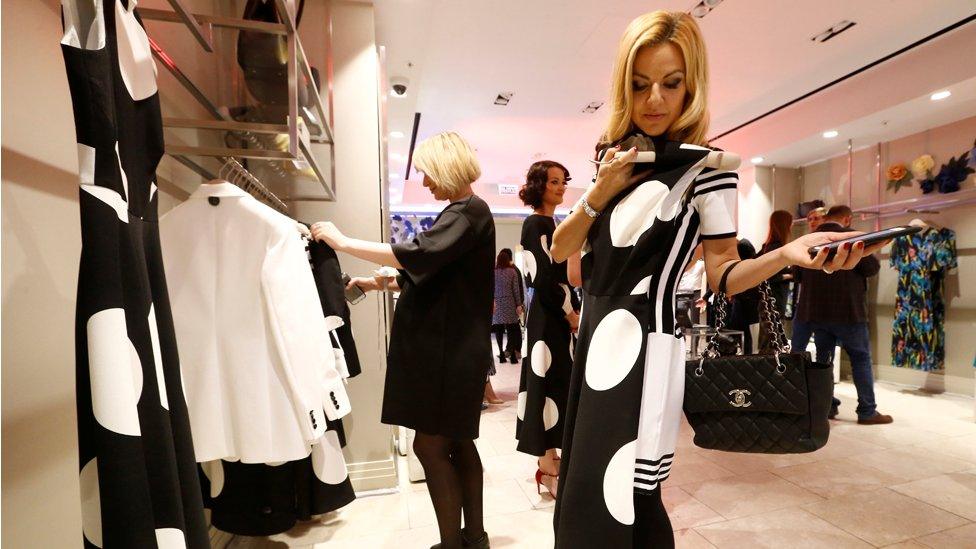 Women look at clothing in LK Bennett, Moscow