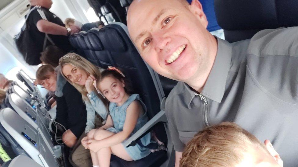 Rob Gore and his family on the plane to Turkey