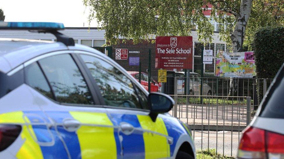 A police car outside the Sele school