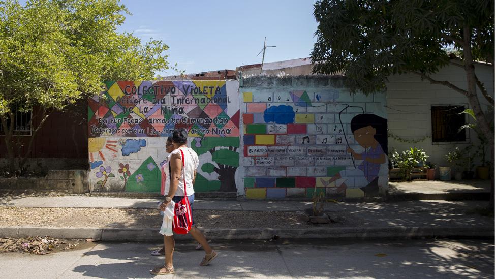 Alneris Orozco Caupo and other women living in the City walk down "Avenida Guerrera," or "Avenue of the Woman Warrior" in Turbaco