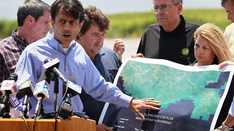 Louisiana Governor Bobby Jindal points to a map showing the areas that might be affected by BP's massive oil spill as he meets with the media on May 10, 2010 in Lafourche Parish, Louisiana.