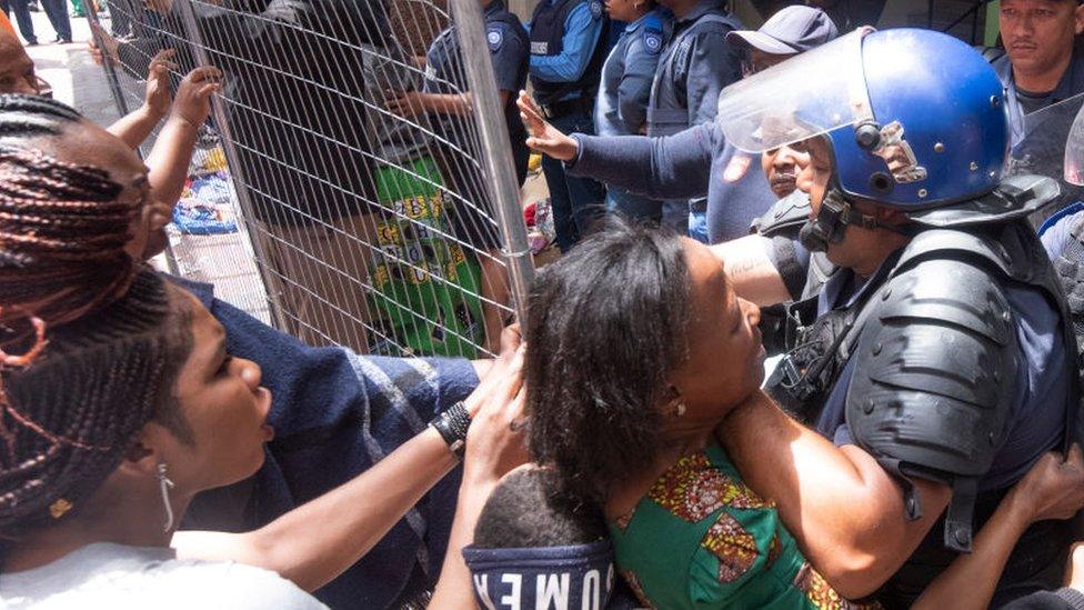 Police clash with foreign nationals staging a sit-in protest at Waldorf Arcade