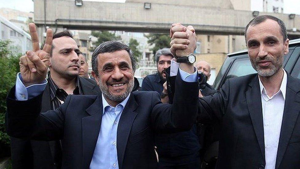 Mahmoud Ahmadinejad holds hands with former vice-president, Hamid Baghaei (12 April 2017)