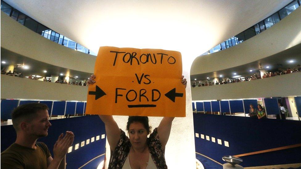 Anti-Doug Ford protesters gather in Toronto's city hall