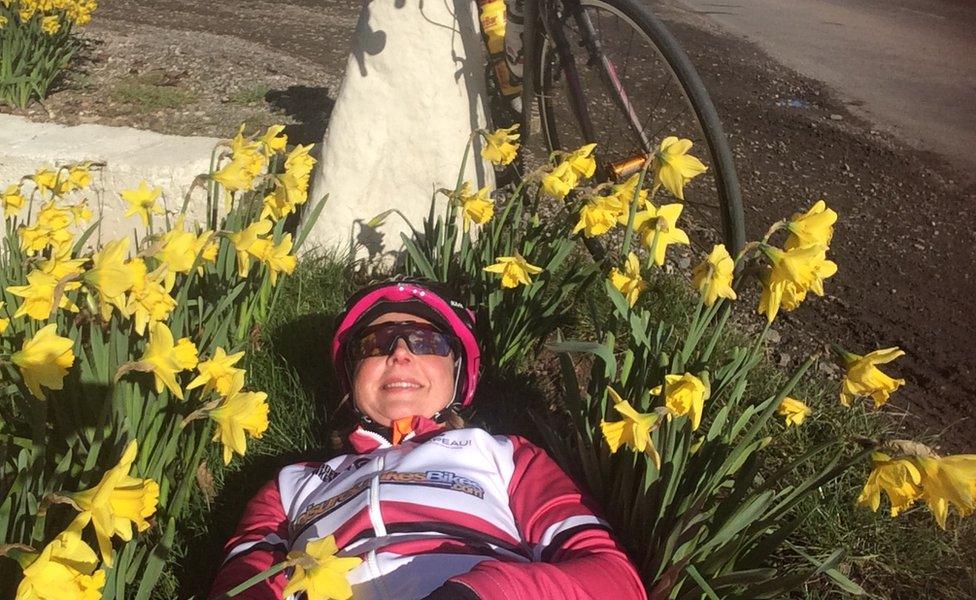 Kajsa Tylen in a bed of flowers