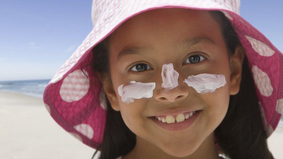 Child in sun hat.