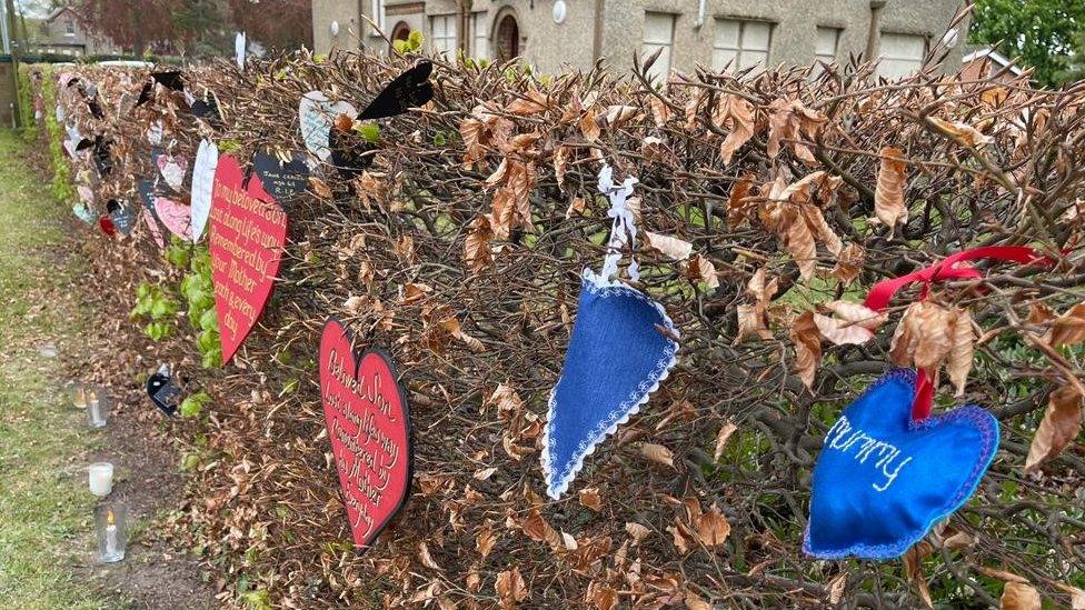 Paper hearts on hedges at the NSFT Norwich headquarters