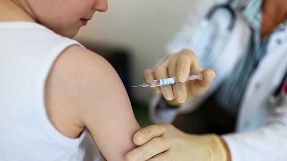 Boy being vaccinated