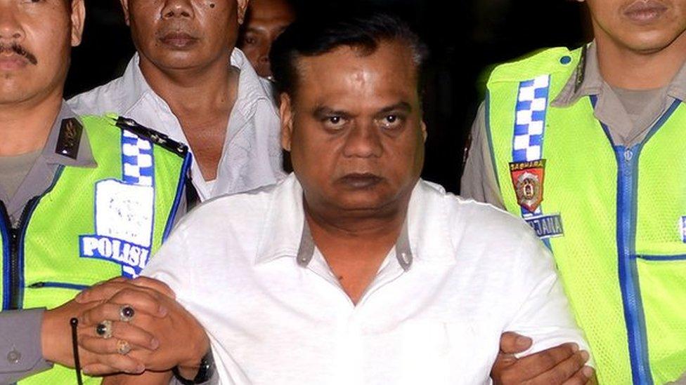 Indonesian police escort Chhota Rajan from Bali police headquarters to Ngurah Rai Airport during his deportation from the country.