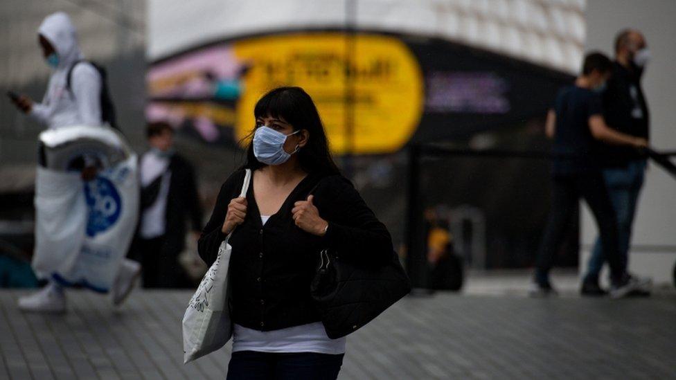 A woman wearing a mask in Birmingham city centre