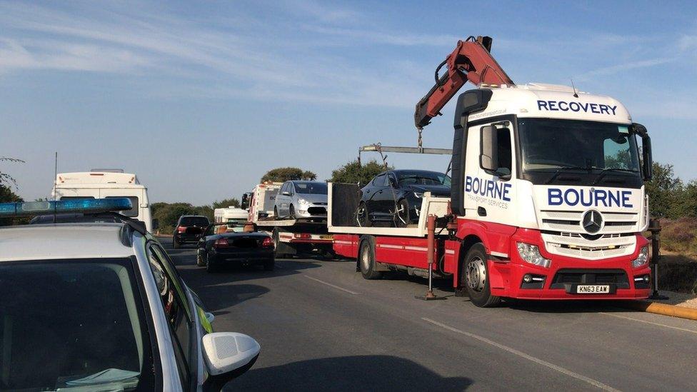 Vehicles being removed at Studland